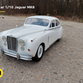Lifestyle photo of 1/10 scale RC Jaguar MK8 model, white vintage car on gravel path, 3D printed RC car