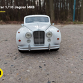 Lifestyle photo of RC model Jaguar MK8, white 1/10 scale remote control car, front view.