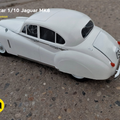 Lifestyle photo of 1/10 scale RC model Jaguar MK8, white vintage car on gravel surface, 3D printed RC car.