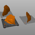 Slicer screenshot of Doom Dark Ages Shoulder Armor STL orange segments distributed across three Prusa print beds ready for 3D printing