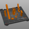 Slicer screenshot of Grace Ashcroft Handgun RE Requiem STL parts arranged on circular Prusa virtual print bed top-down view