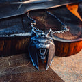Metallic 3D printed Witcher 4 Lynx medallion on a dark wooden block – Witcher 4 Lynx Pendant 3D print | 3Demon