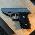 Lifestyle photo of 3D printed Grace Ashcroft Handgun Resident Evil Requiem cosplay prop pointing forward showing muzzle and frame texture detail