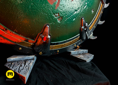 Close-up lifestyle photo of Shield Saw Doom weapon resting on base beams of 3D printed stand showing metallic vs wood texture