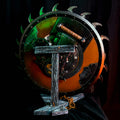 Lifestyle photo of 3D printed Shield Saw Stand with Doom weapon mounted front view showing green orange battle-worn shield