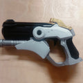 Digital 3D render of hero shooter game winged medic Blaster STL, grey and black 3D printed cosplay prop.