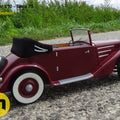 Lifestyle photo of 3D printed RC model Tatra 75, maroon vintage car on gravel path, 1/10 scale