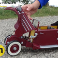 Hand photo of RC model Tatra 75, 1/10 scale, red 3D printed car with open hood.