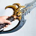 Solo Leveling Kasaka's Venom Fang, hand holding 3D printed prop, gold and dark grey cosplay weapon