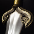 Close-up of a decorative eowyn sword hilt with intricate horse designs on a black background