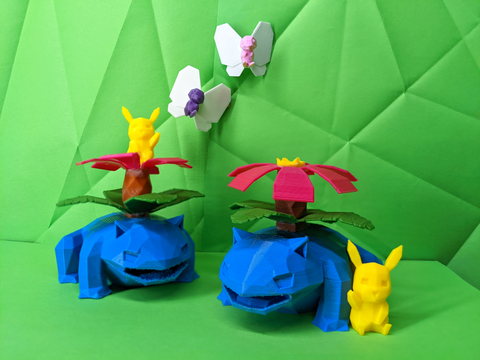 Toy frogs with flower structures and butterflies on a green geometric-patterned background with pikachu in front