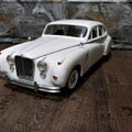 Lifestyle photo of RC model Jaguar MK8, white classic car 3D printed scale model.