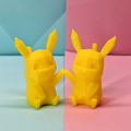 Two yellow 3D-printed Pikachu figures on a split light blue and pink background holding hands