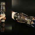 Hand photo of Rey Skywalker’s Lightsaber 3D print, black hilt with five-pronged guard, gold blade.