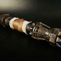 Textured 3D render of Rey Skywalker Lightsaber STL, bronze hilt with black grip, spiked emitter.