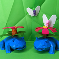 Two venusaur with pink flowers and white butterflies on a green background
