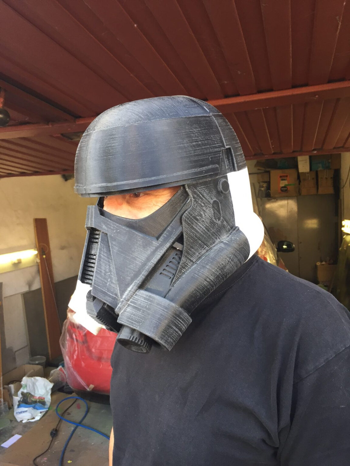 Lifestyle photo of Death Trooper helmet - Star Wars Rogue One, black 3D printed cosplay prop.