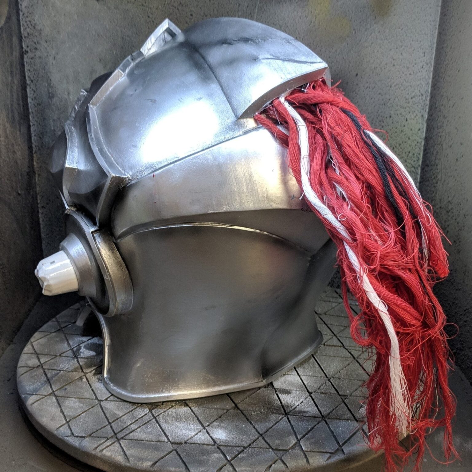 3D model render of Goblin Slayer helmet STL, metallic 3D print cosplay armor with red plume.