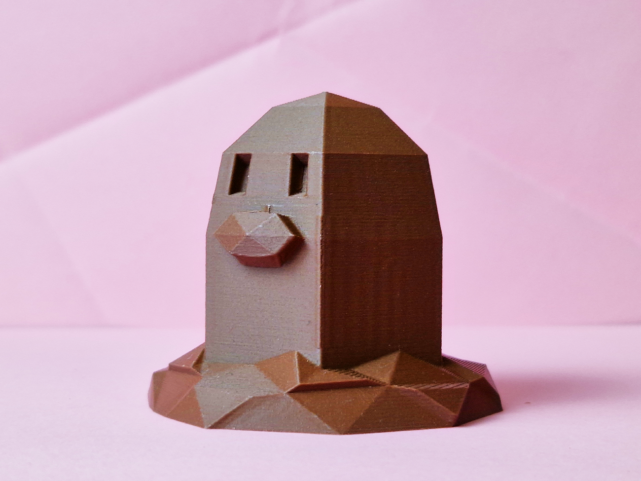 Photo of 3D printed Diglett STL collectible figure, brown earth-toned, front view