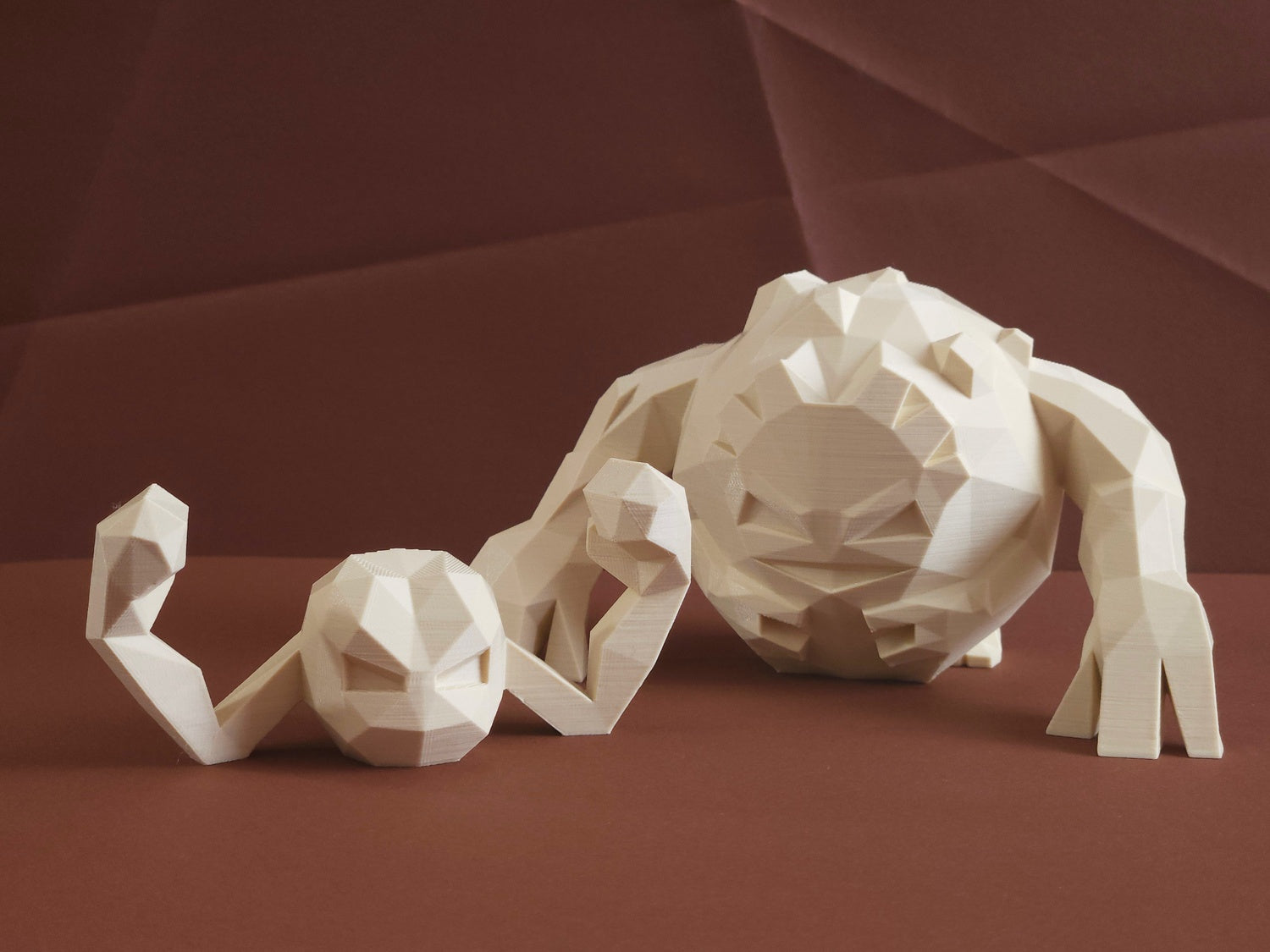 Geodude 3D printed collectible figure, beige polyhedral design, side profile view