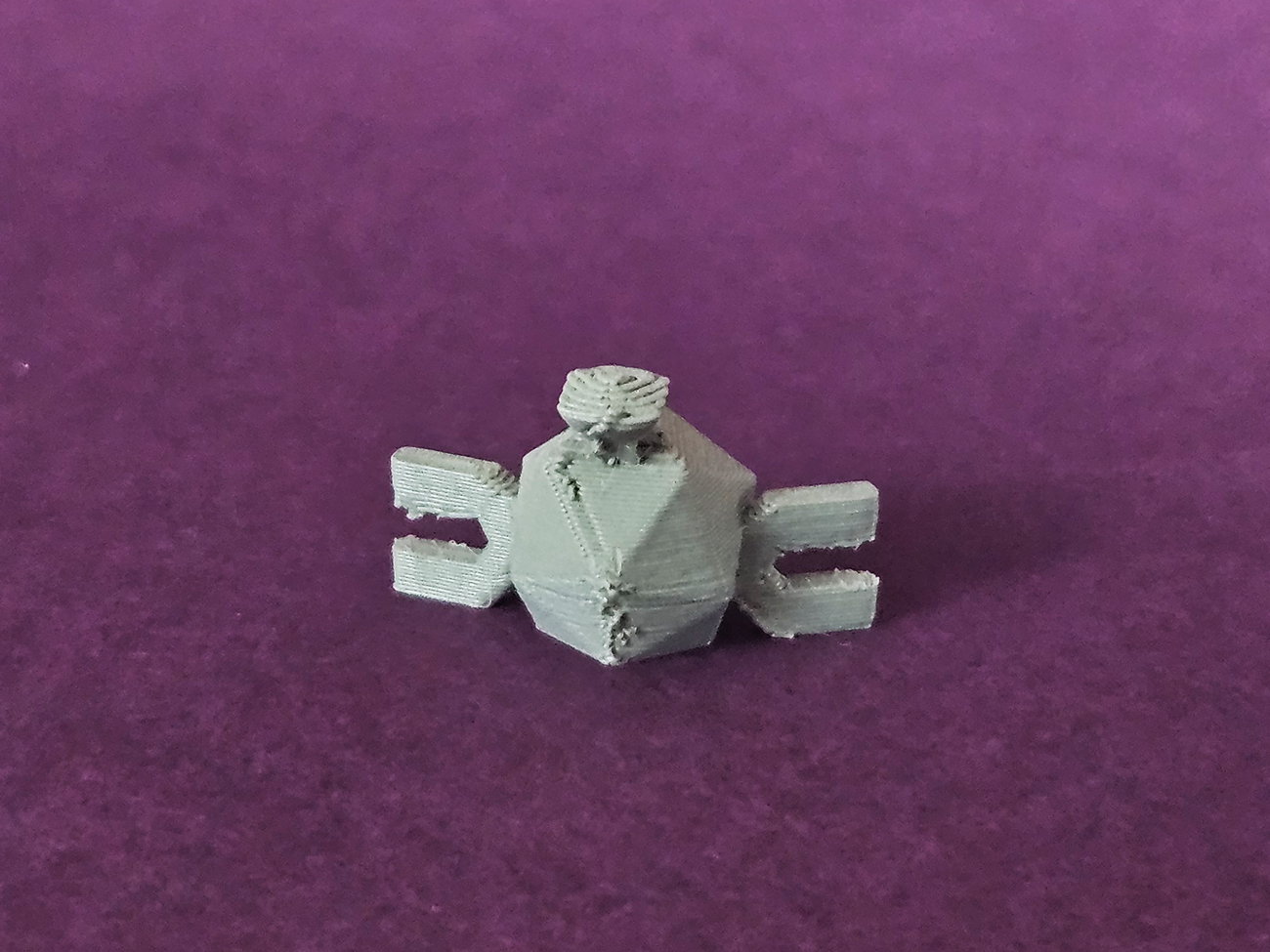 3D printed Magnemite STL collectible figure, light grey metallic, front view