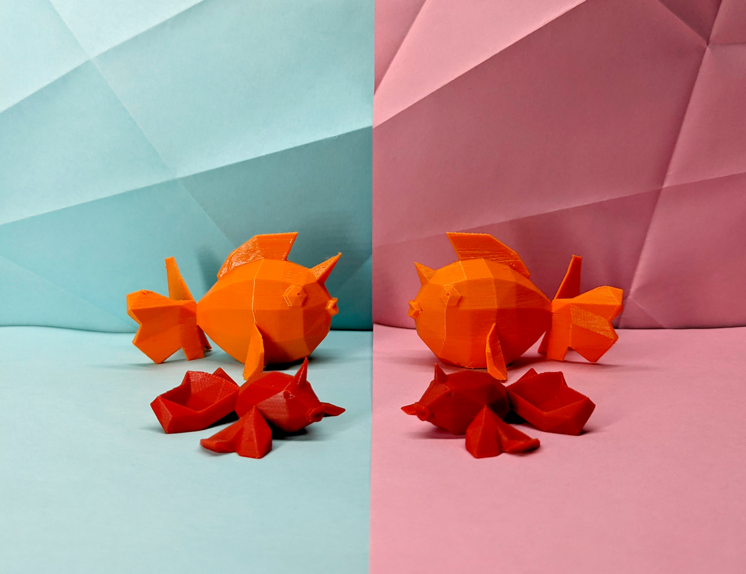 Orange low poly fish on a split background of blue and pink with geometric patterns.