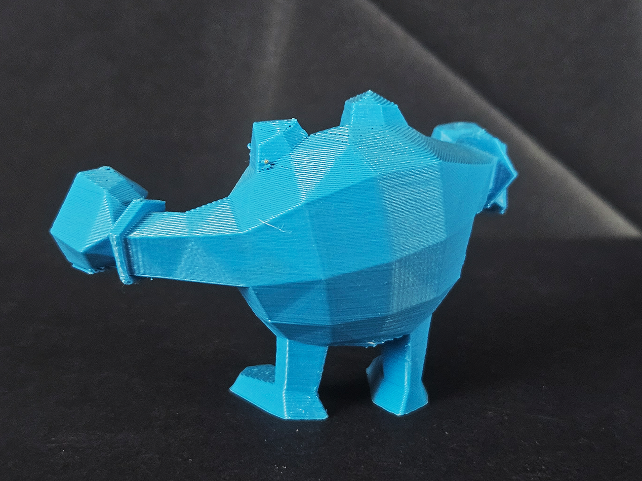 3D printed Poliwrath STL collectible figure, blue, rear view, plain background