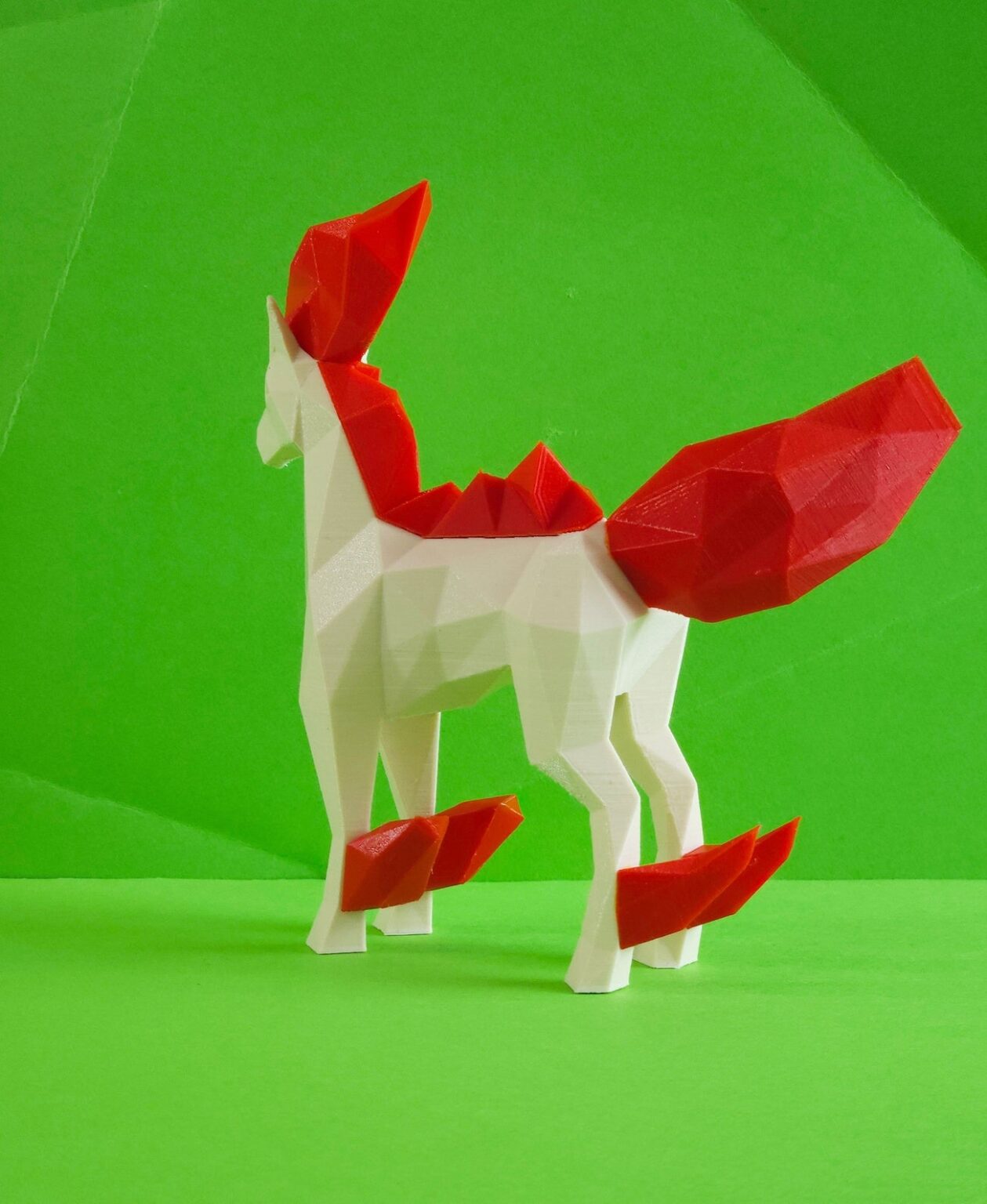 3D printed Rapidash STL collectible figure, white/red, dynamic side pose, plain green background