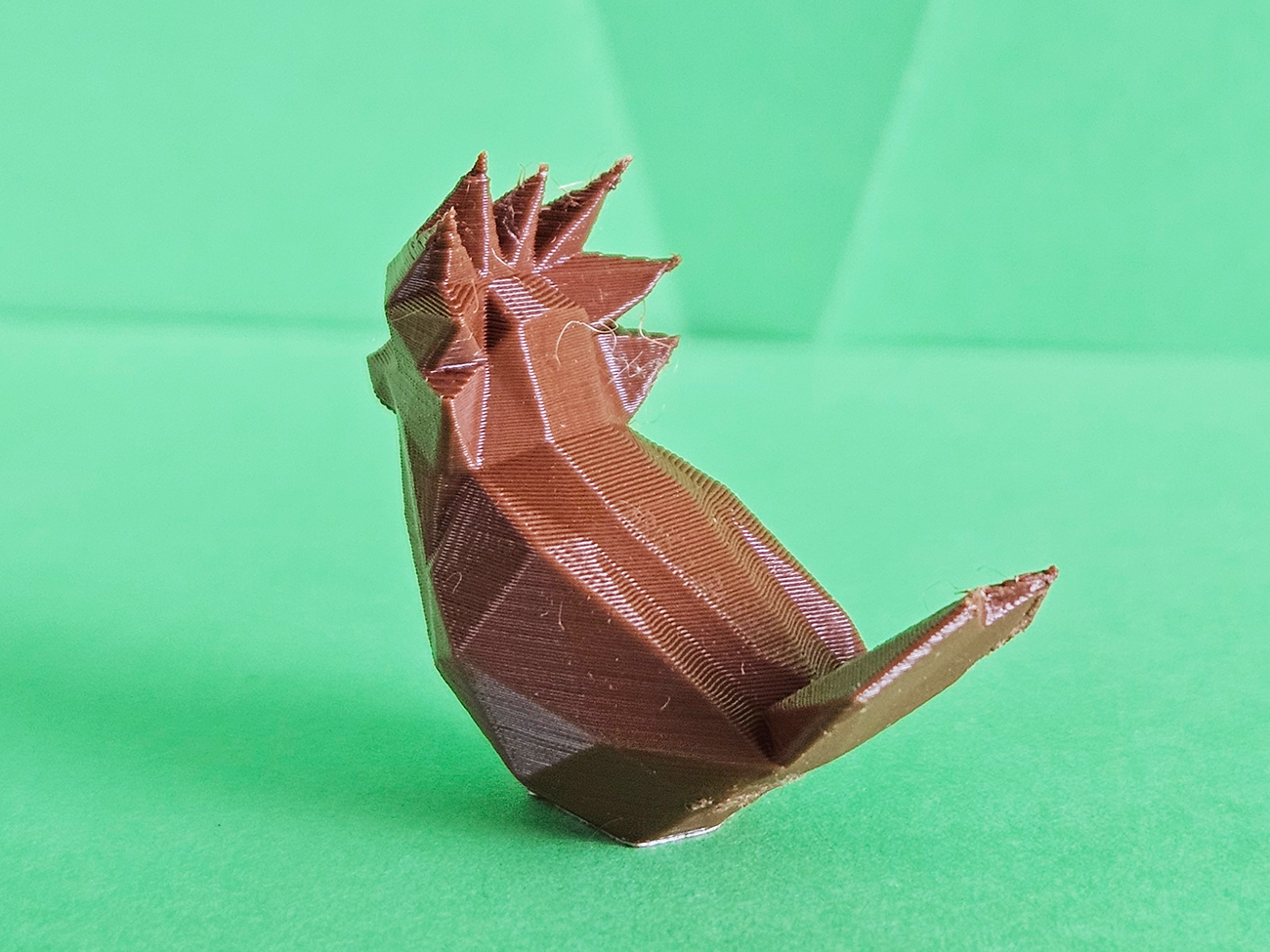 3D printed Spearow STL collectible figure, brown feathered body, side profile view
