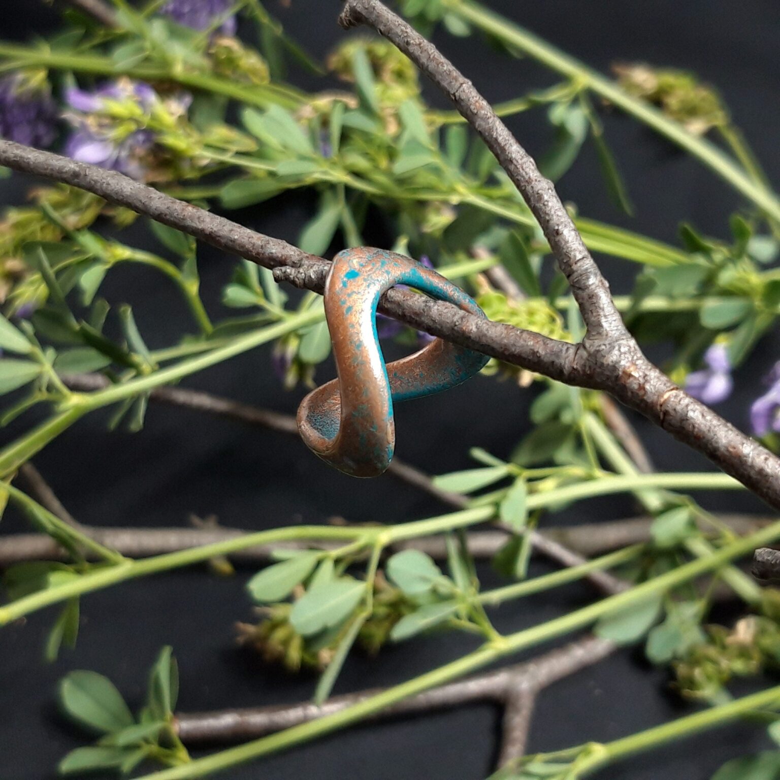 Digital 3D render of Celtic Ring STL, copper-toned knot design on leafy branch, 3D print accessory.
