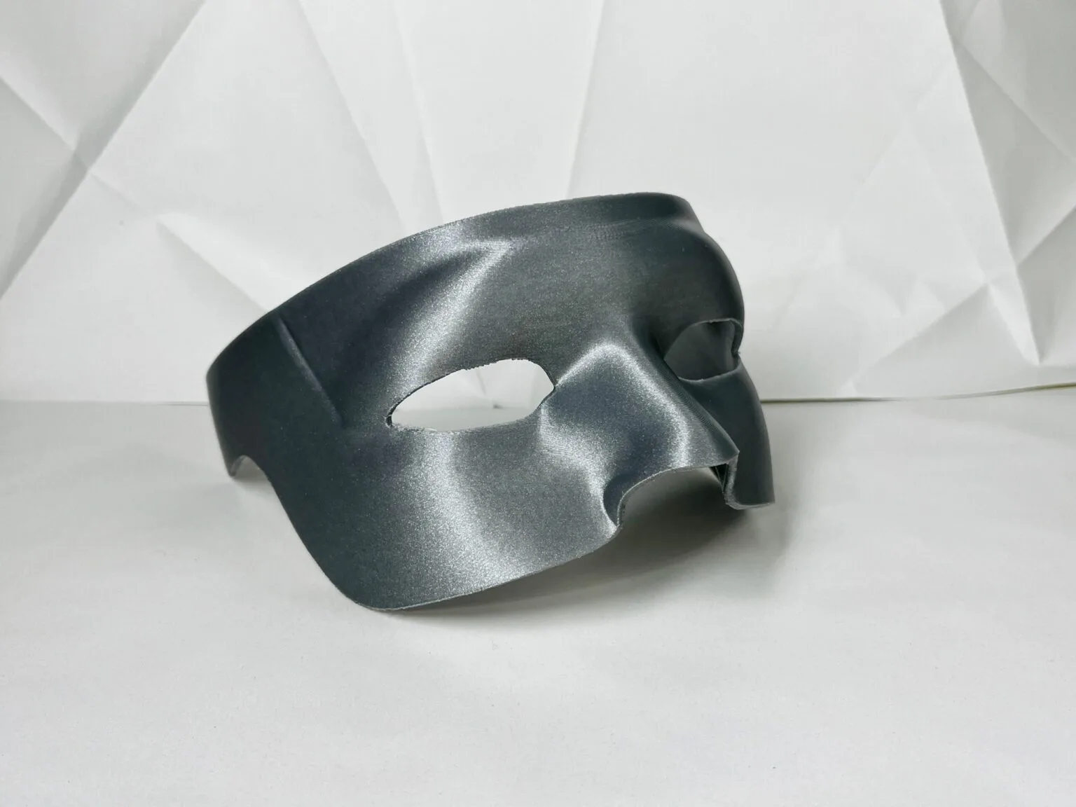 3D model render of Kato mask, sleek black 3D print cosplay accessory