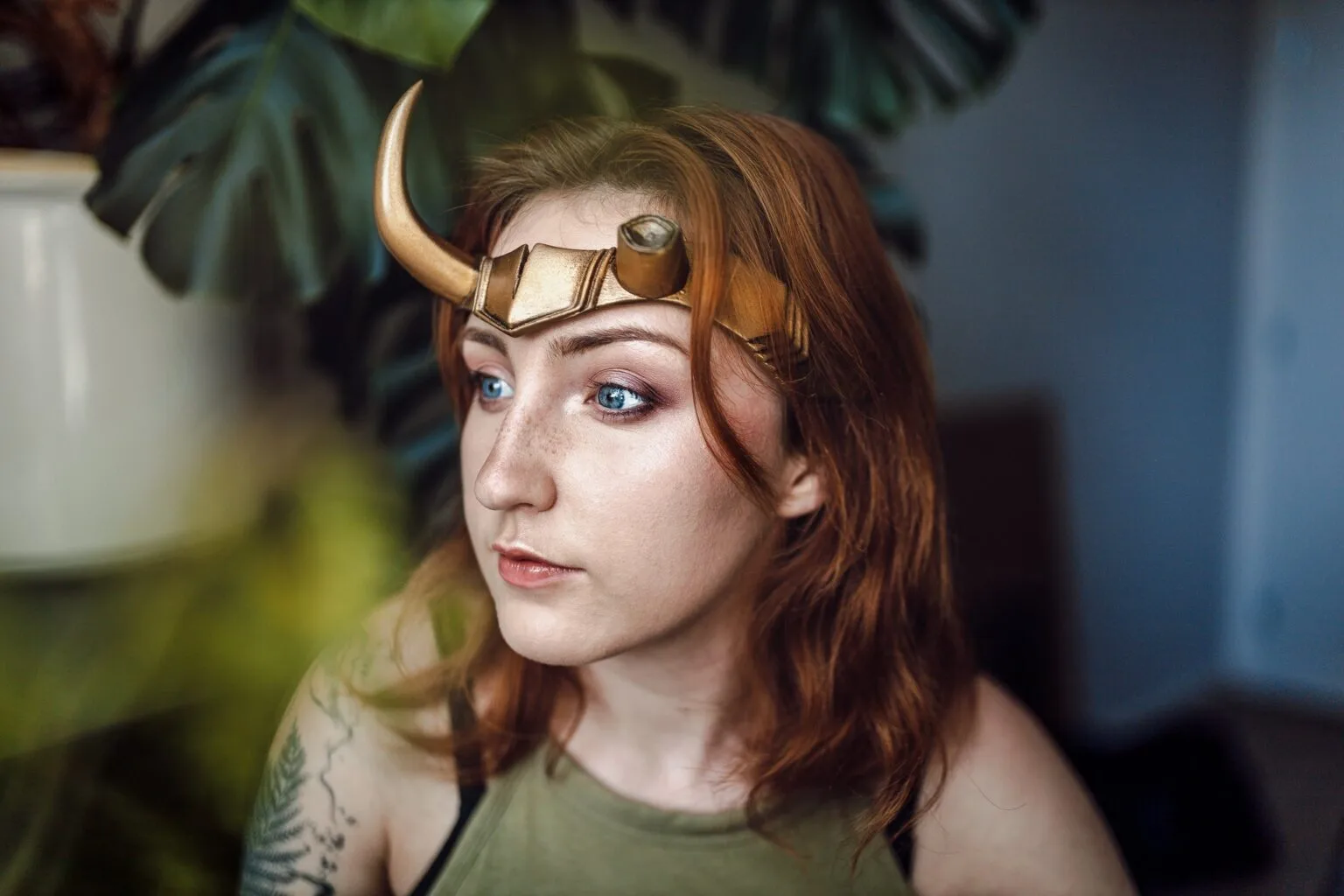 Lifestyle photo of Sylvie Horns Headband cosplay accessory, gold horns with gem accents, worn outdoors