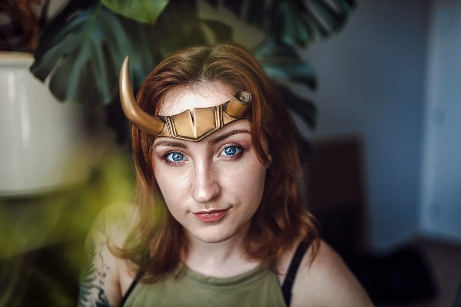 Lifestyle photo of Sylvie Horns Headband cosplay accessory, worn with green top, fantasy prop