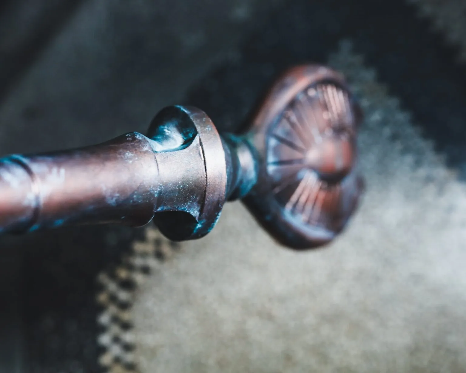 Close-up of Ma'Tok Jaffa Staff STL, detailed metallic screw and gear assembly, 3D print weapon