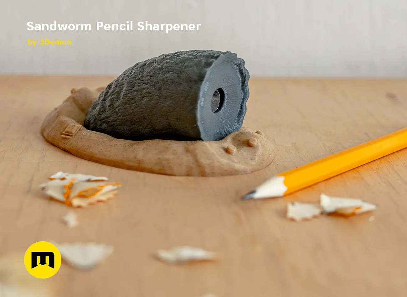 Lifestyle photo of Sandworm Pencil Sharpener 3D print, Dune-inspired design with pencil shavings, desk prop