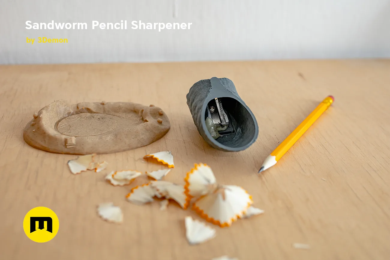 Disassembled parts of Sandworm Pencil Sharpener - Dune, 3D printed with wooden base and pencil shavings.