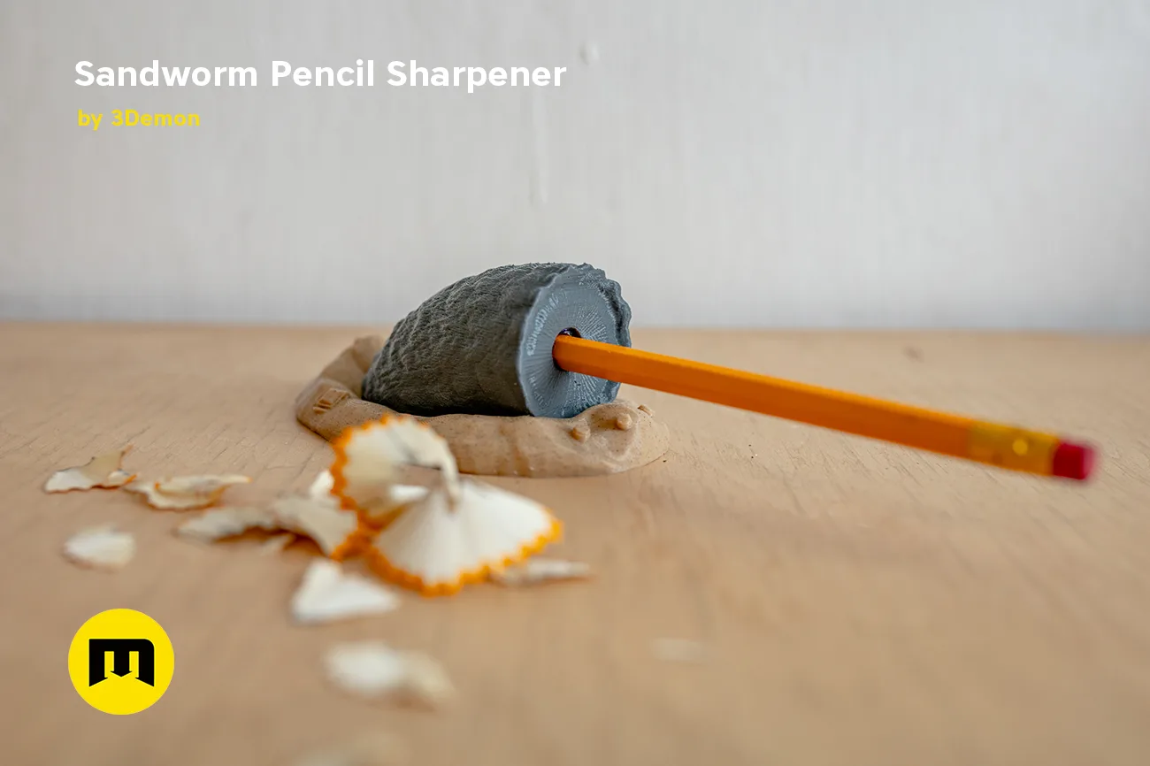 Lifestyle photo of Sandworm Pencil Sharpener 3D print, Dune-inspired design with pencil shavings.