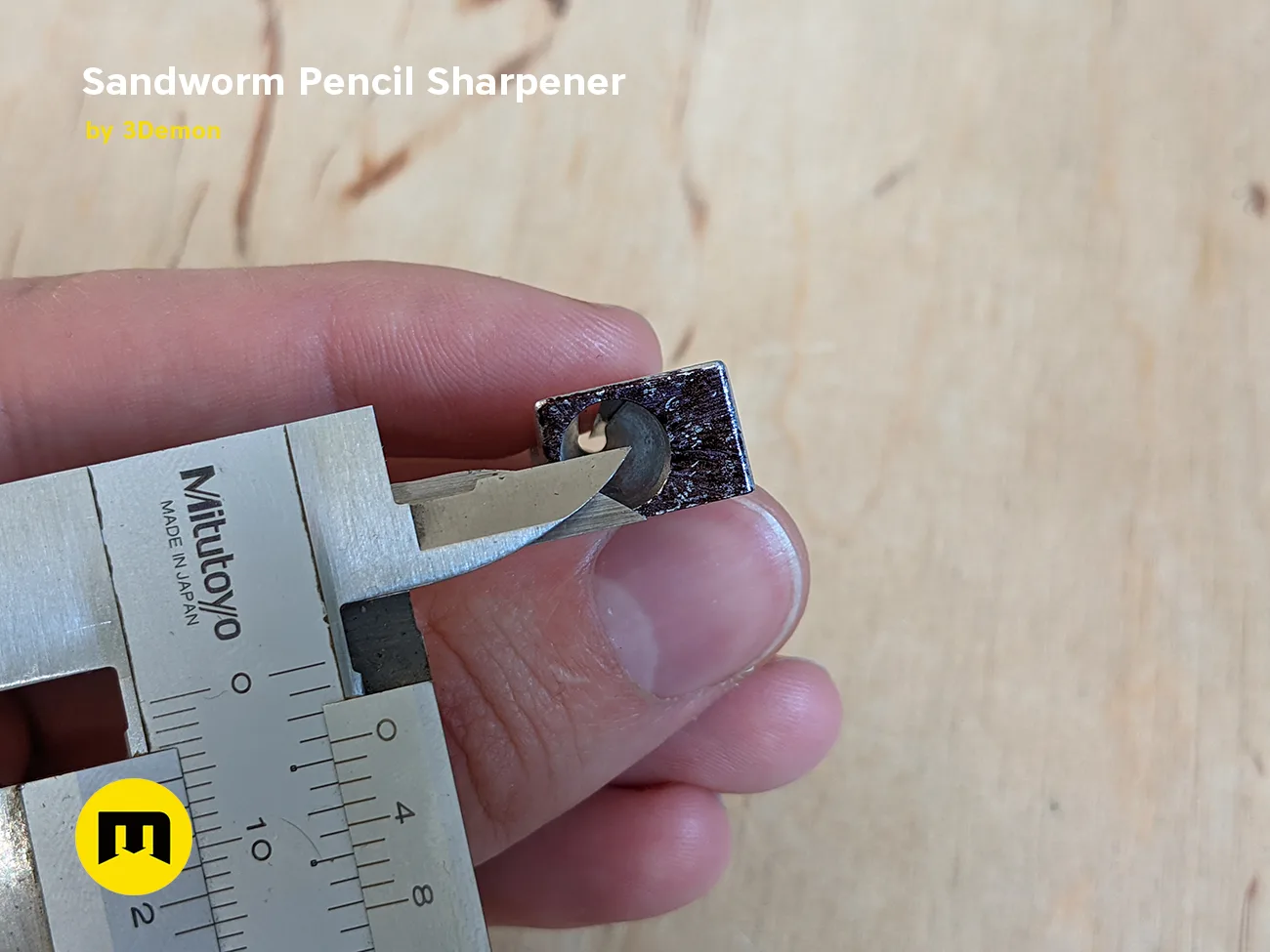 Hand photo of Sandworm Pencil Sharpener - Dune 3D print, close-up of metal blade assembly.