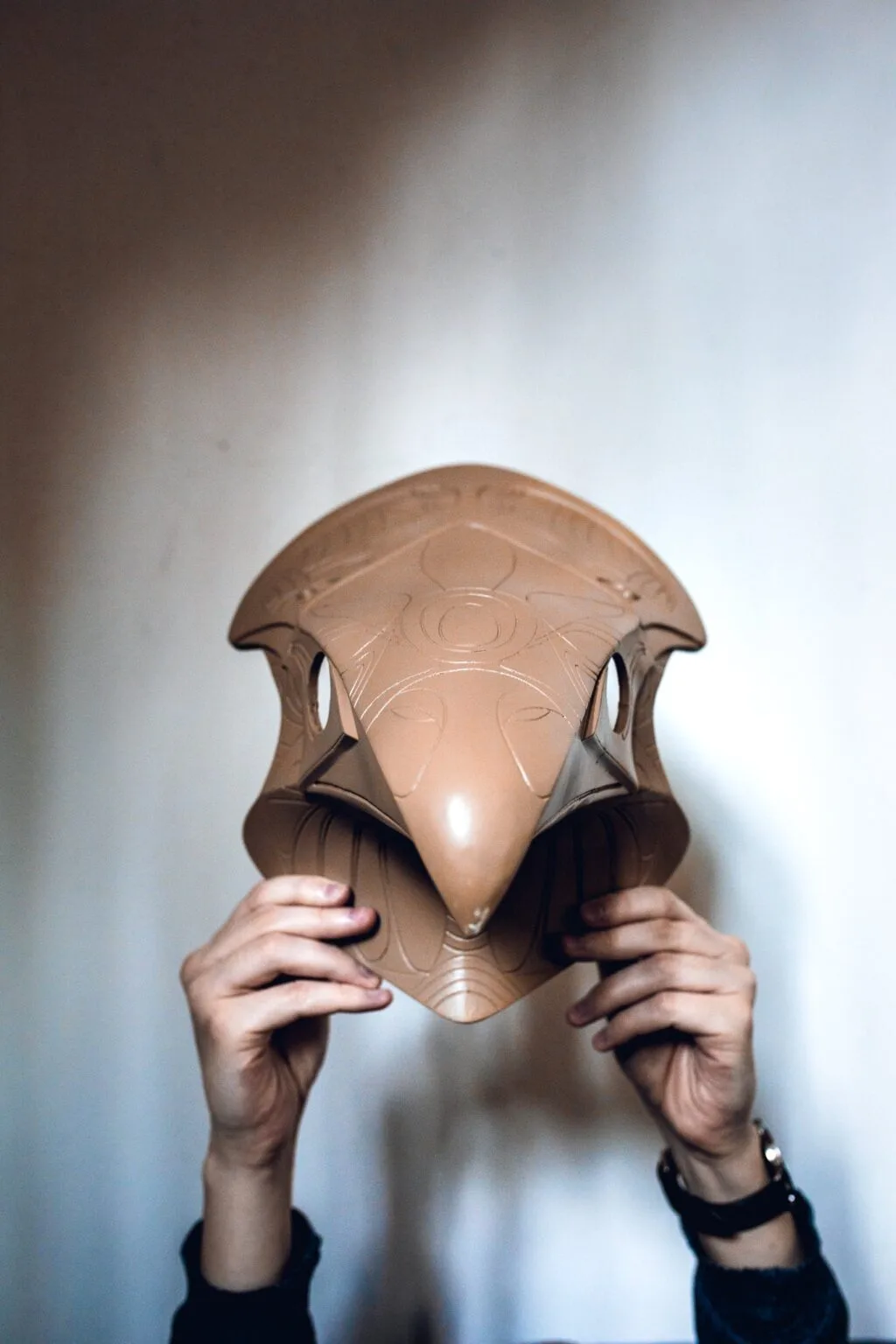 Hand photo of Horus Helmet STL, ancient Egyptian 3D printed cosplay prop held up.