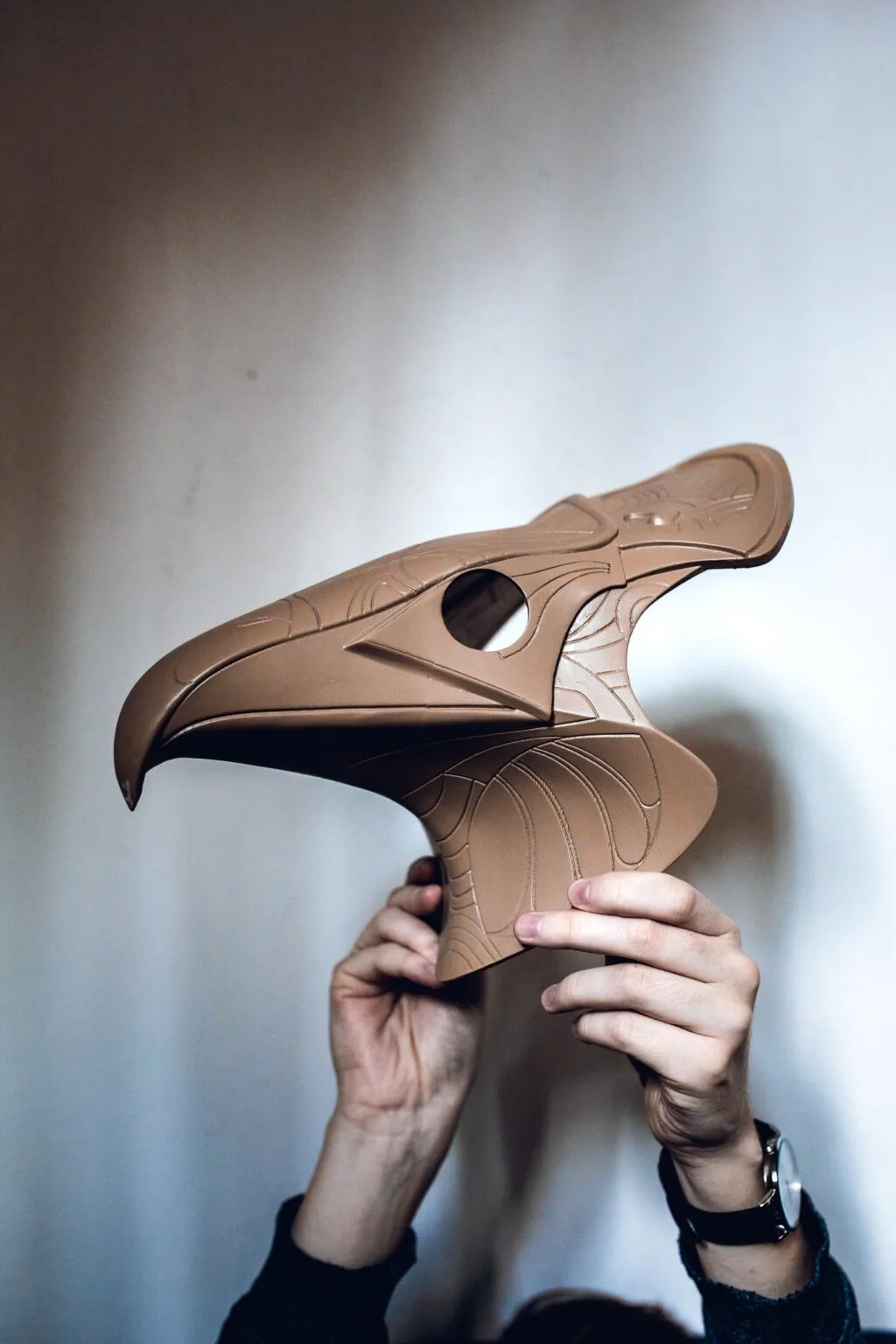 Hand photo of Horus Helmet STL, brown 3D printed cosplay armor, side view detail