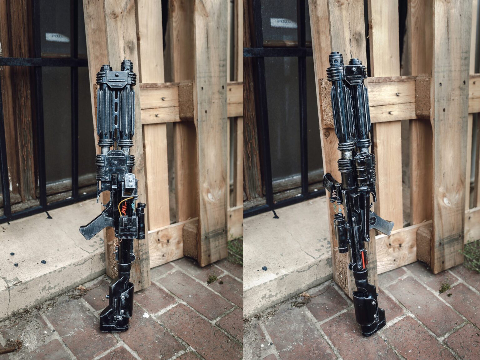 Lifestyle photo of E-22 Blaster Pistol 3D print, black exploded view on wooden door frame