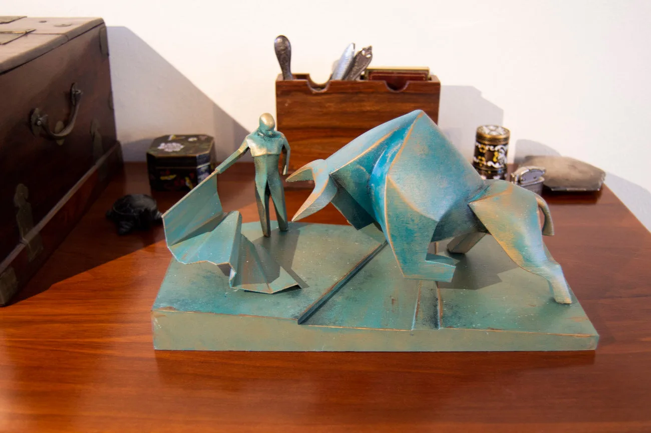 Lifestyle photo of Bull Statue - Dune collectible figure, bronze finish on wooden desk