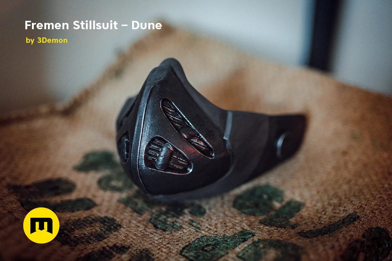 Lifestyle photo of Fremen Stillsuit Mask - Dune, detailed 3D printed cosplay prop on textured fabric