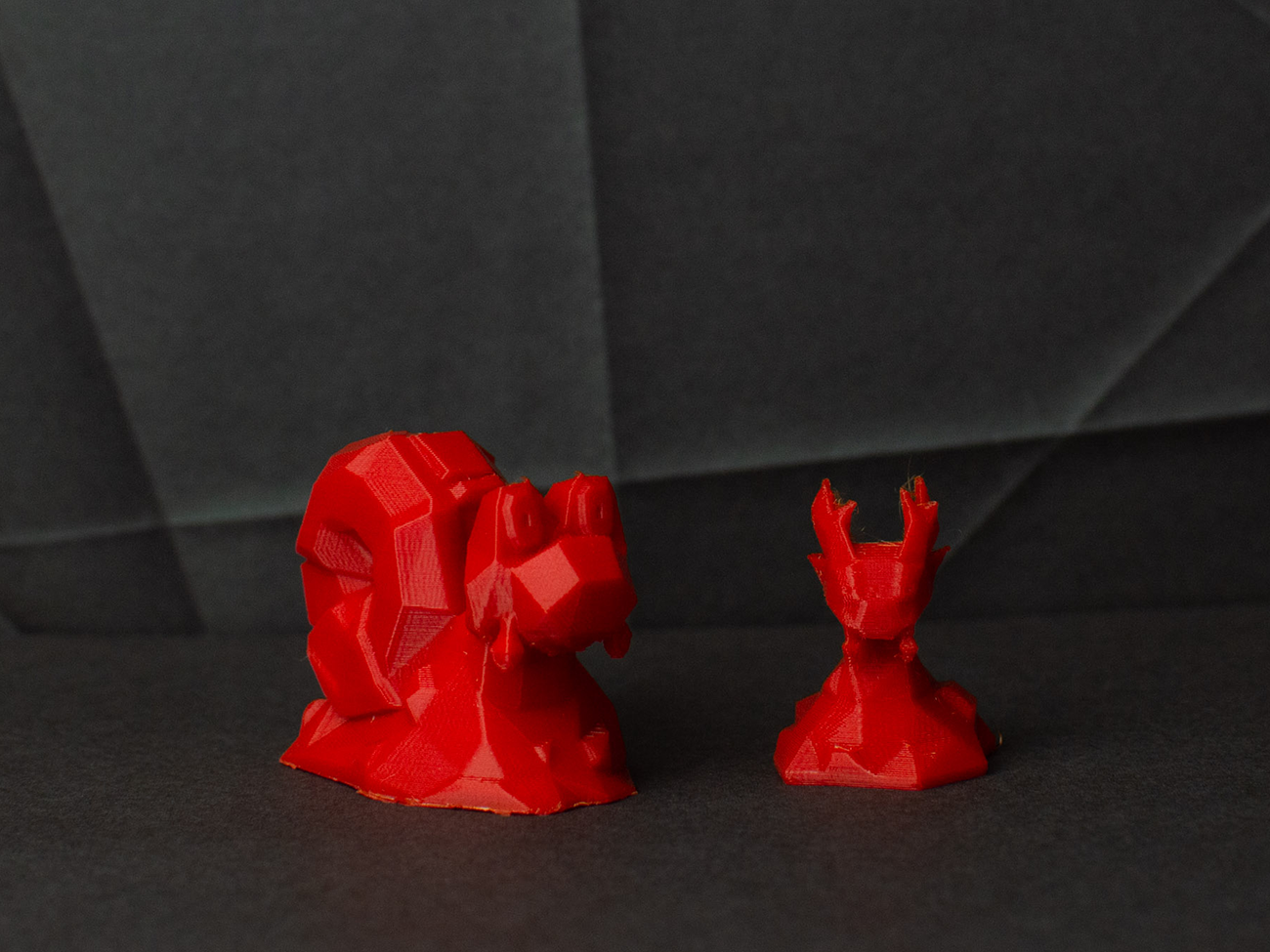3D print preview of Magcargo, dual red alien creature with detailed head and clawed legs, STL model
