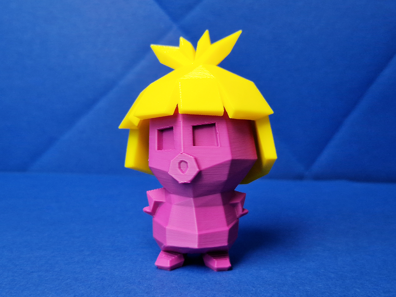 3D model render of Smoochum, pink collectible figure with yellow spiky hair, 3D print preview