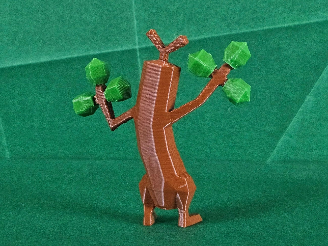 3D visualization of Sudowoodo STL, dancing brown figure with green leaf arms, collectible figure