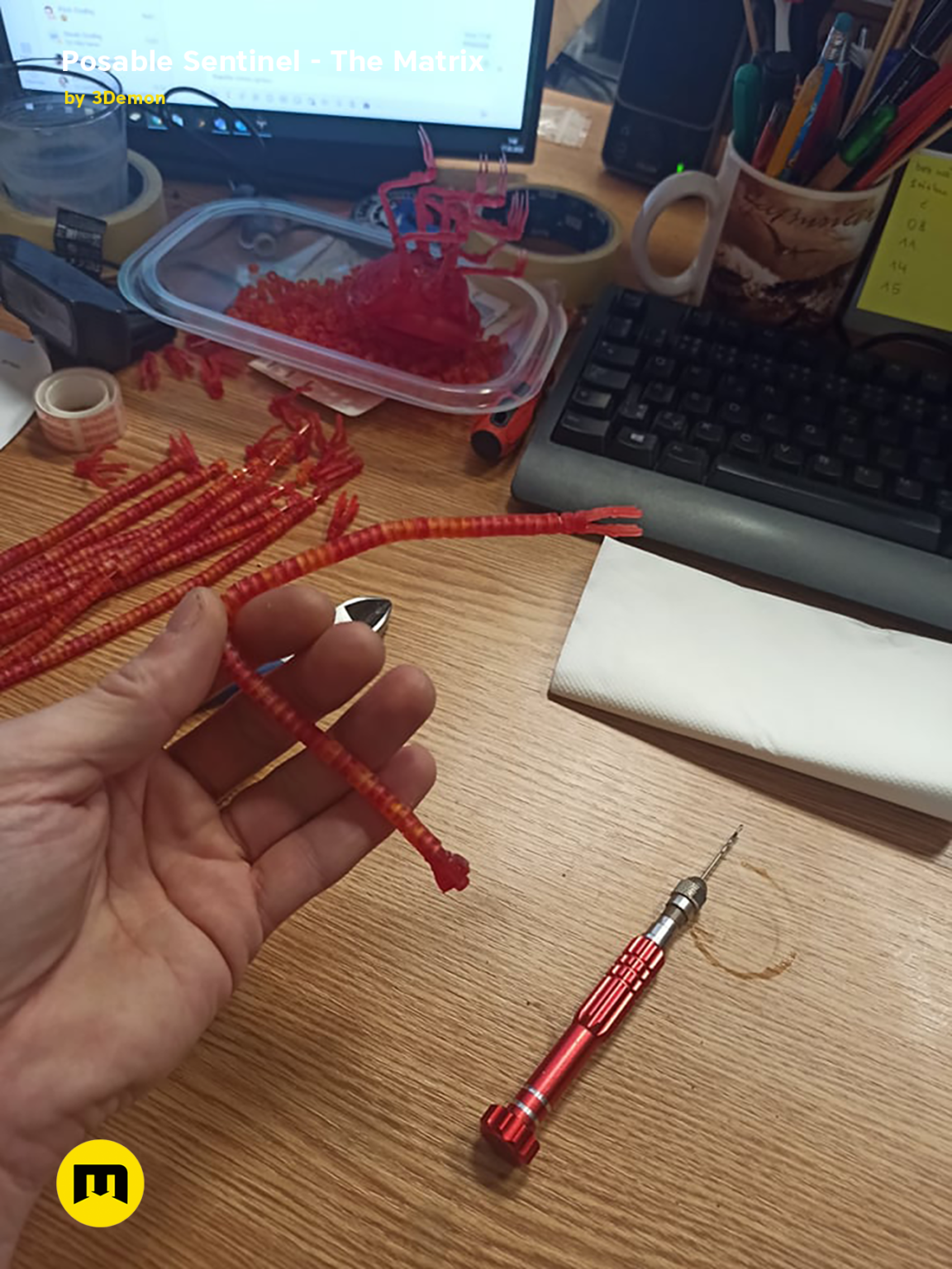 Hand photo of Posable Sentinel - The Matrix 3D printed cosplay prop, red articulated figure.