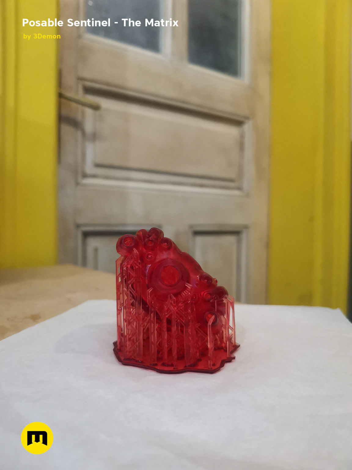 Lifestyle photo of Posable Sentinel - The Matrix 3D printed cosplay prop, red translucent finish.