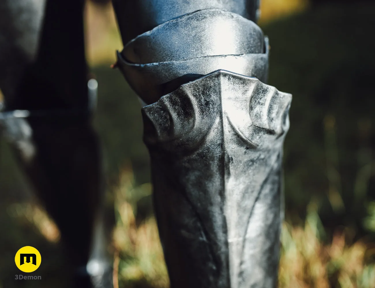Close-up of 3D printed Galadriel Armor - Rings of Power, detailed silver leaf-shaped pauldrons.