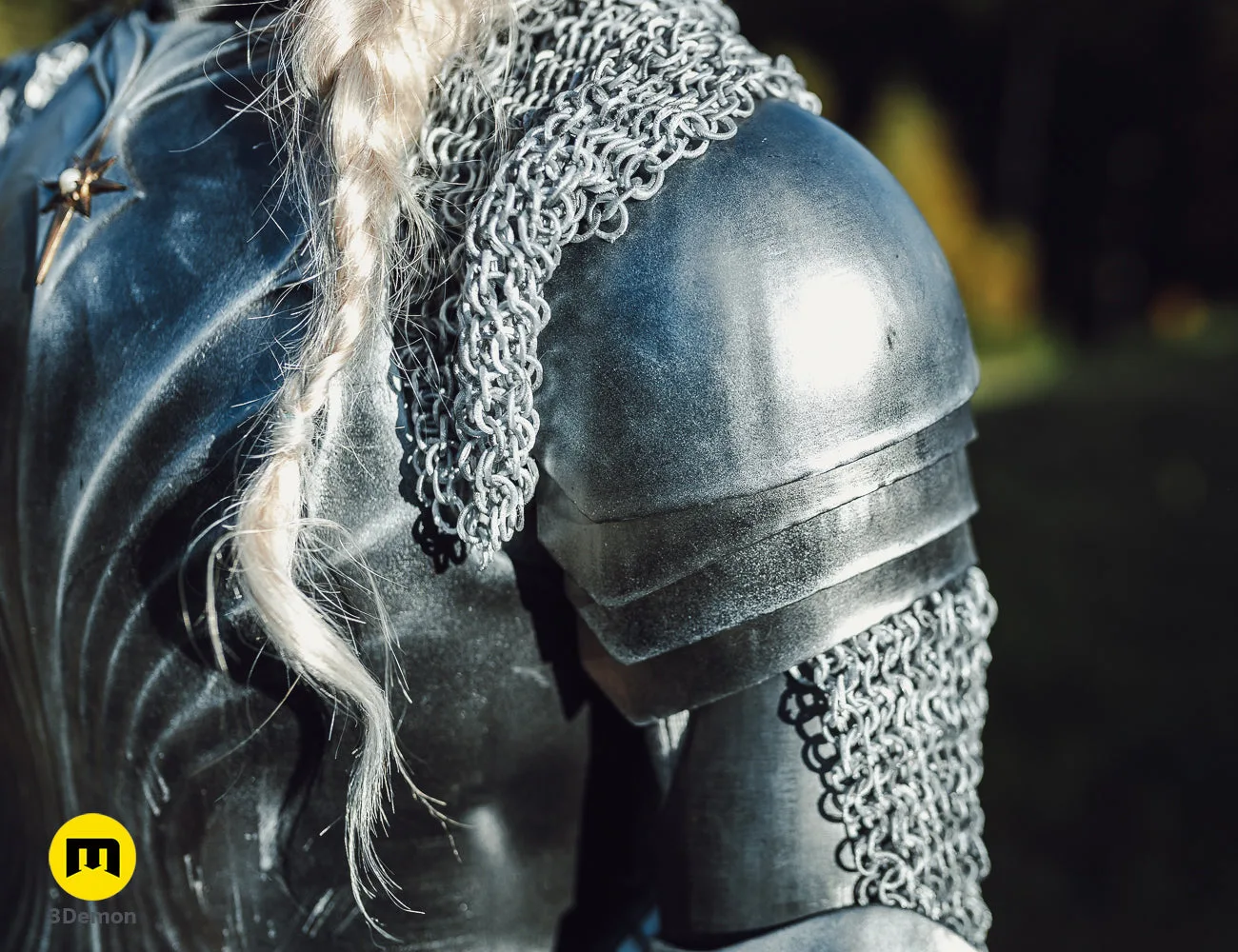Close-up of Galadriel Armor - Rings of Power 3D print, silver chainmail and polished metal shoulder guard.